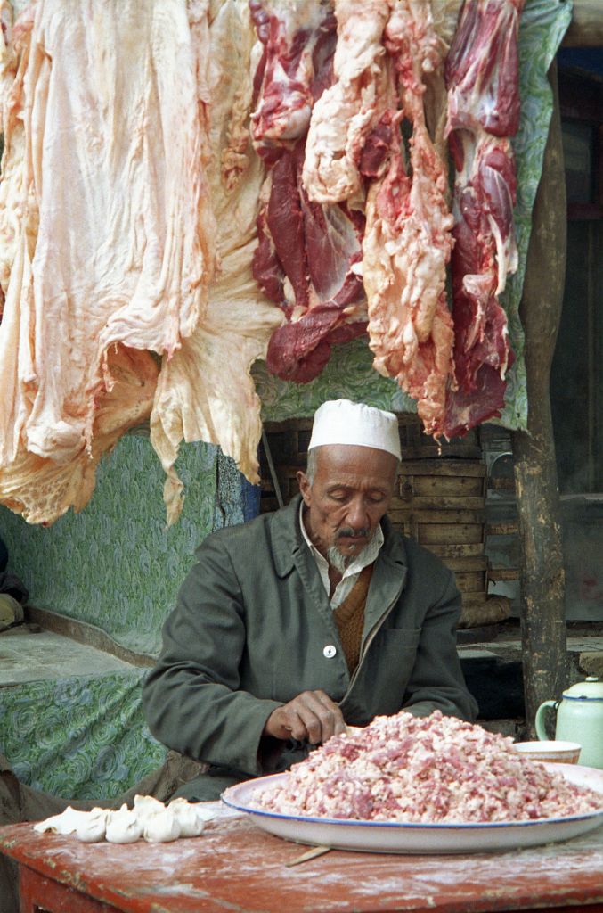47 Kashgar Sunday Market 1993 Man Making Meat Dumplings